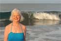 Nadina in blue dress in the water